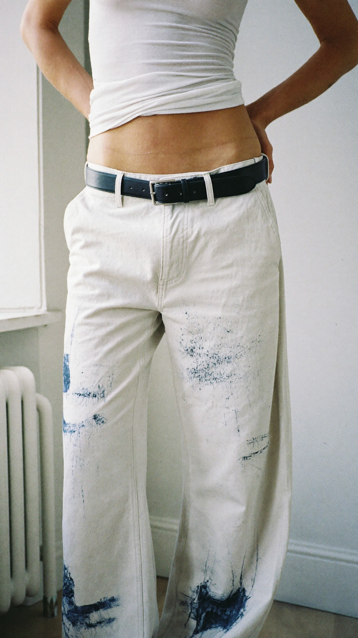 Minimal, ecru trousers, leather belt
